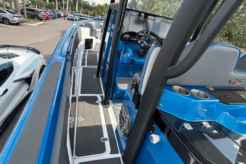 Slide: The Image of 2024 GSX 36 boat interior with blue accents and modern dashboard design. - 30
