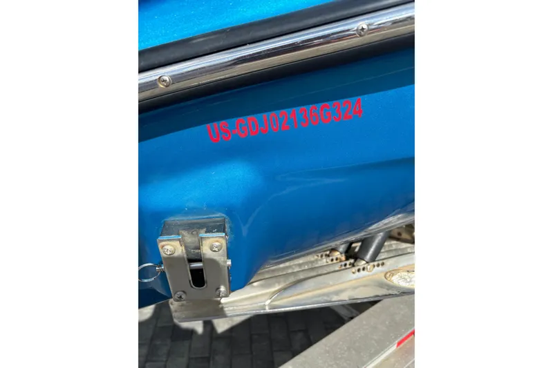 Slide: The Image of Blue 2024 GSX 36 boat with visible registration number on the hull. - 41
