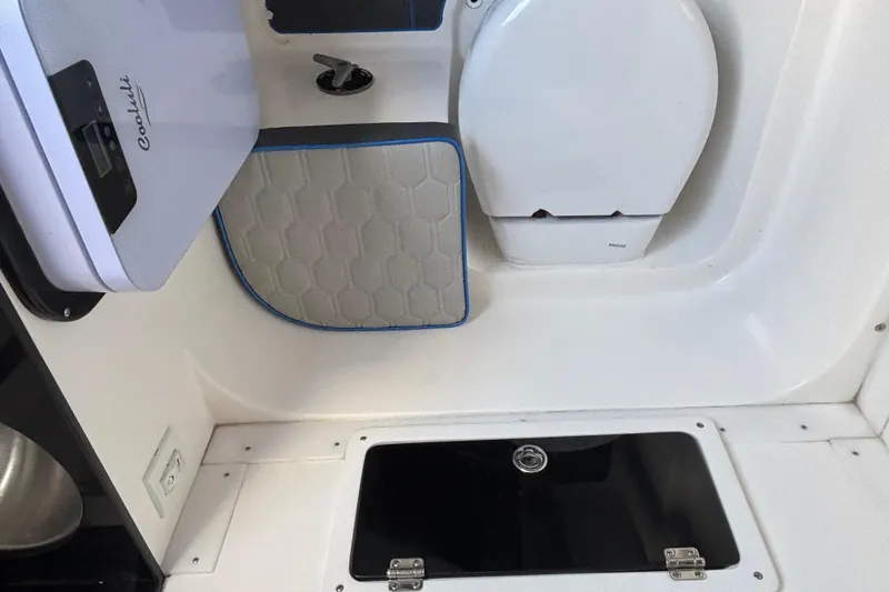 Slide: The Image of 2024 GSX 36 interior with compact toilet and storage compartment. - 13