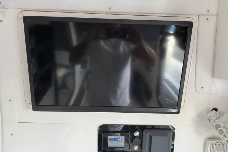 Slide: The Image of 2024 GSX 36 interior with Vizio TV and control panel. - 16