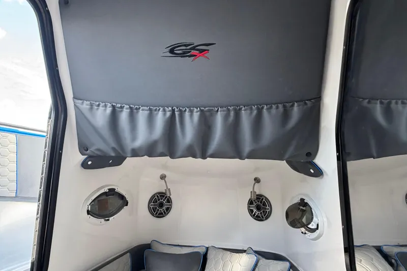 Slide: The Image of 2024 GSX 36 boat interior with speakers and cushioned seating. - 17