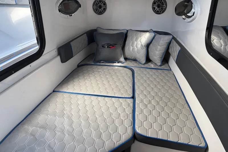 Slide: The Image of Luxurious cabin interior of 2024 GSX 36 boat with hexagonal-patterned cushions. - 19