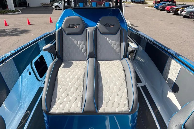Slide: The Image of 2024 GSX 36 boat interior with dual gray seats and blue accents. - 21