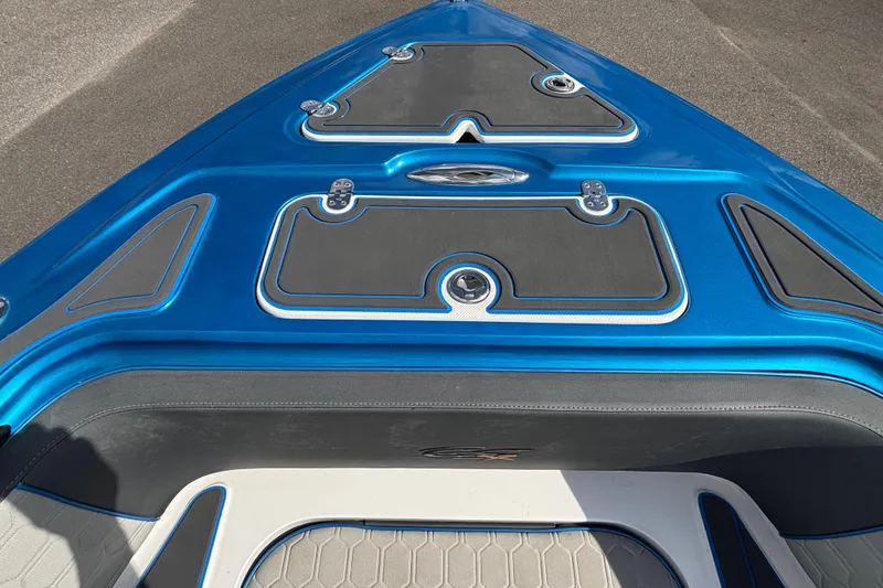 Slide: The Image of 2024 GSX 36 boat deck, featuring sleek blue design and modern fittings. - 23
