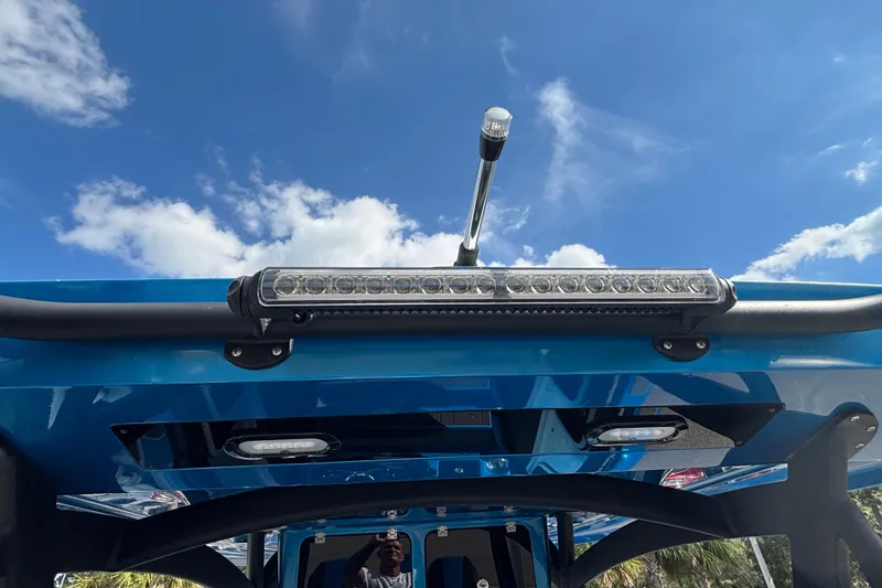 Slide: The Image of 2024 GSX 36 boat with blue canopy and mounted LED light bar under clear sky. - 26