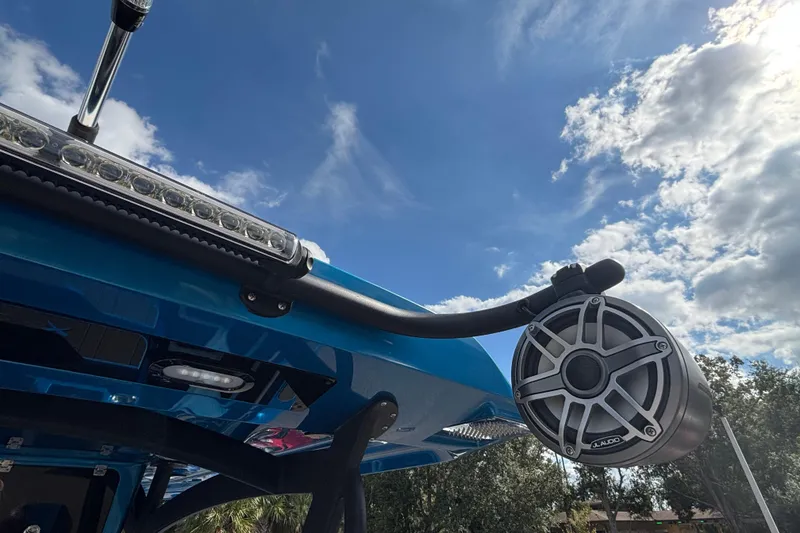 Slide: The Image of 2024 GSX 36 boat with speaker and light bar under blue sky. - 27