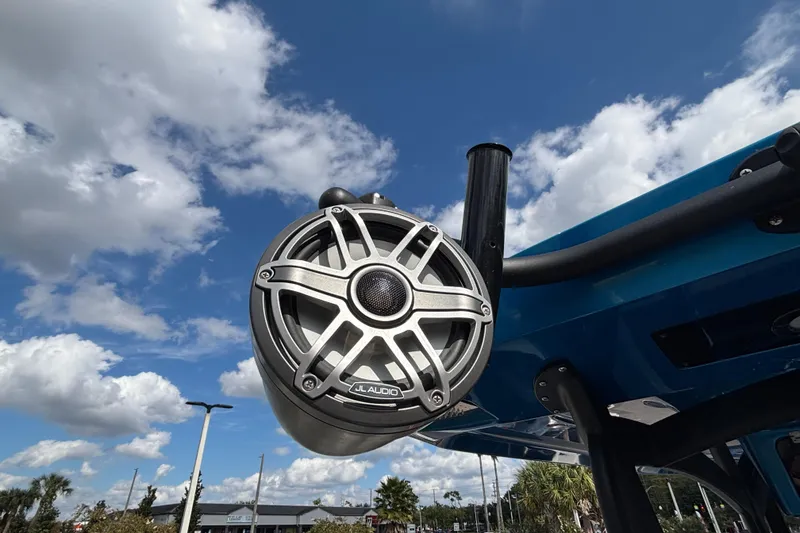 Slide: The Image of Outdoor JL Audio speaker on a 2024 GSX 36 boat under a blue sky. - 28