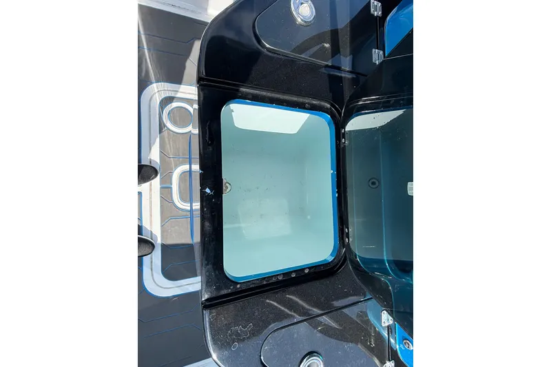 Slide: The Image of 2024 GSX 36 boat storage compartment with open lid, showcasing interior design. - 35