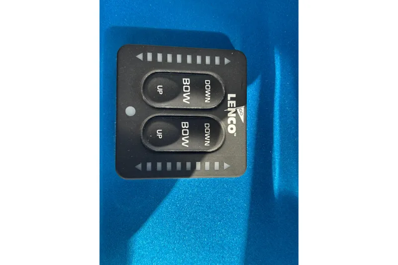 Slide: The Image of Lenco trim tab control panel on blue GSX 36, 2024 model. - 8