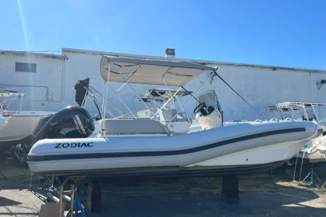 Slide: The Image of 2023 Zodiac N-ZO 680 boat with canopy, displayed outdoors. - 1