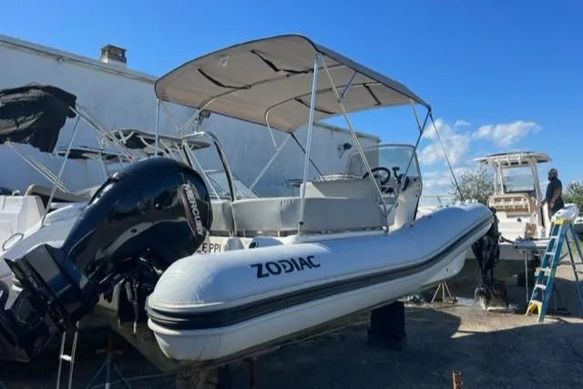 Slide: The Image of 2023 Zodiac N-ZO 680 inflatable boat with canopy and outboard motor. - 3