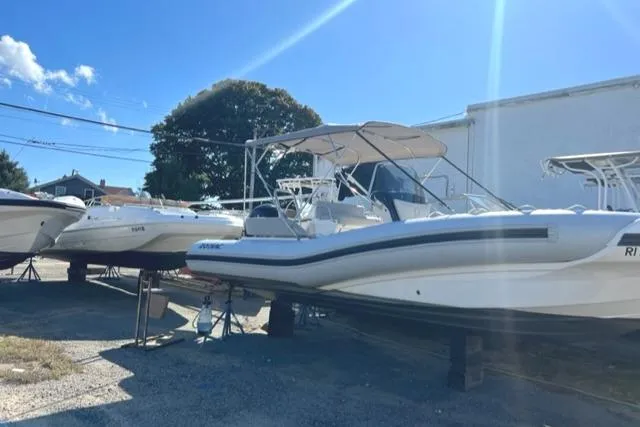 Slide: The Image of 2023 Zodiac N-ZO 680 boat displayed outdoors under clear blue sky. - 4