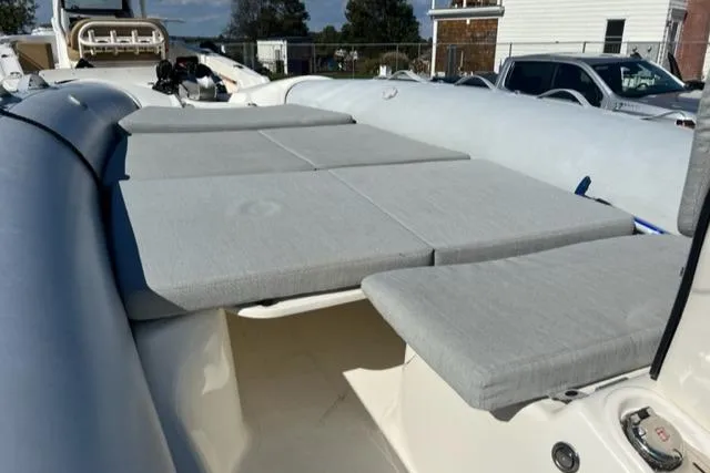 Slide: The Image of 2023 Zodiac N-ZO 680 boat with cushioned seating and sleek design. - 7