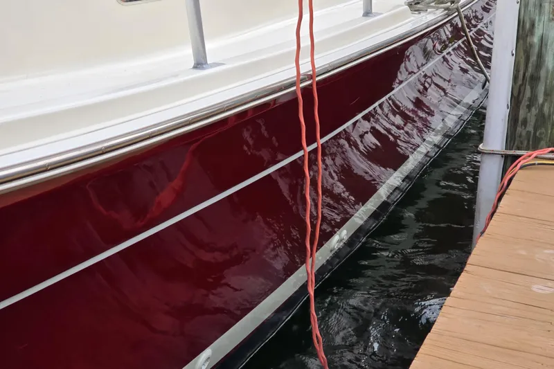 Slide: The Image of Engine compartment of 2001 Mainship 30 Pilot Rum Runner boat, showcasing detailed machinery. - 16