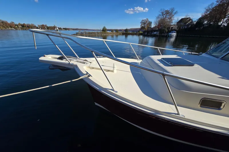 Slide: The Image of 2001 Mainship 30 Pilot Rum Runner control panel with Sony stereo and electrical switches. - 23