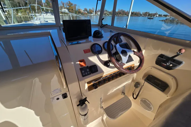 Slide: The Image of Storage compartment with perforated base on 2001 Mainship 30 Pilot Rum Runner boat. - 28