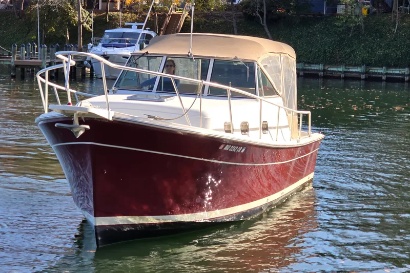 Slide: The Image of 2001 Mainship 30 PILOT helm with steering wheel, gauges, and navigation equipment. - 3