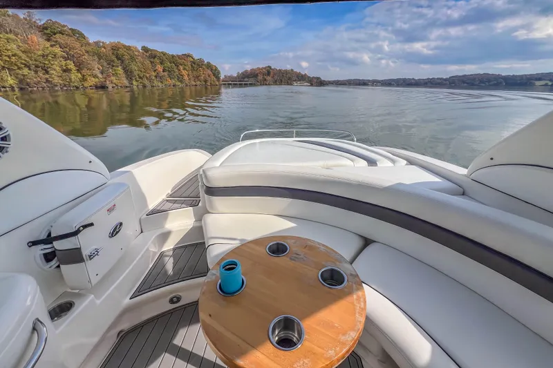 Slide: The Image of 2007 Sea Ray 290 Sun Sport boat interior with lake view and seating area. - 23