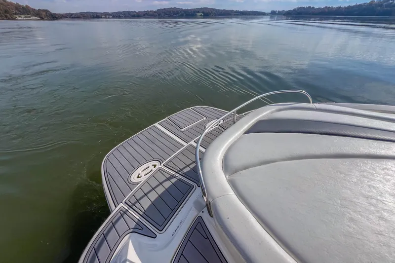 Slide: The Image of 2007 Sea Ray 290 Sun Sport boat on calm lake waters, rear deck view. - 25