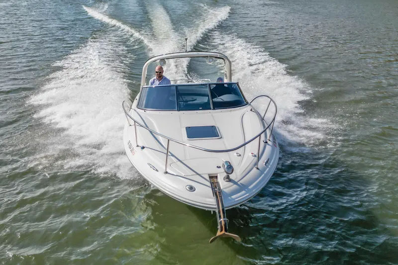 Slide: The Image of 2007 Sea Ray 290 Sun Sport boat cruising on open water. - 4
