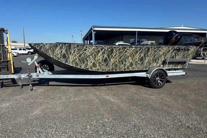 The Image of 2026 Smoker Craft Pro Sportsman 1872 T boat with camouflage design on a trailer. - 0