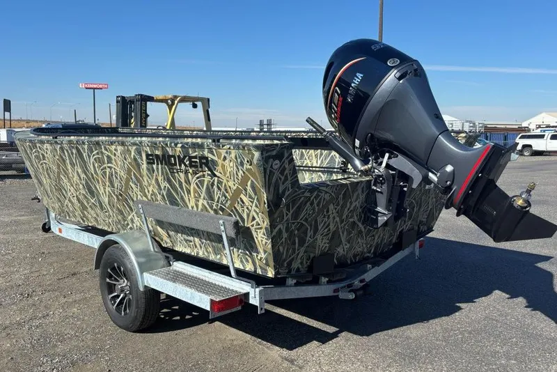 Slide: The Image of 2026 Smoker Craft Pro Sportsman 1872 T boat with camouflage design and Yamaha outboard motor. - 1