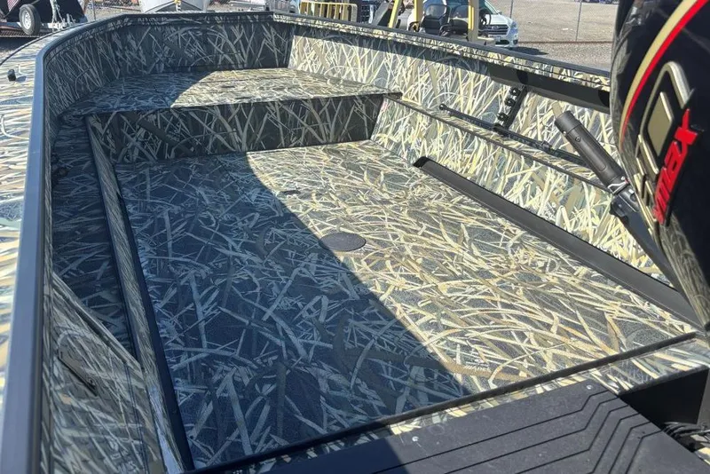 Slide: The Image of 2026 Smoker Craft Pro Sportsman 1872 T boat with camouflage interior design. - 2