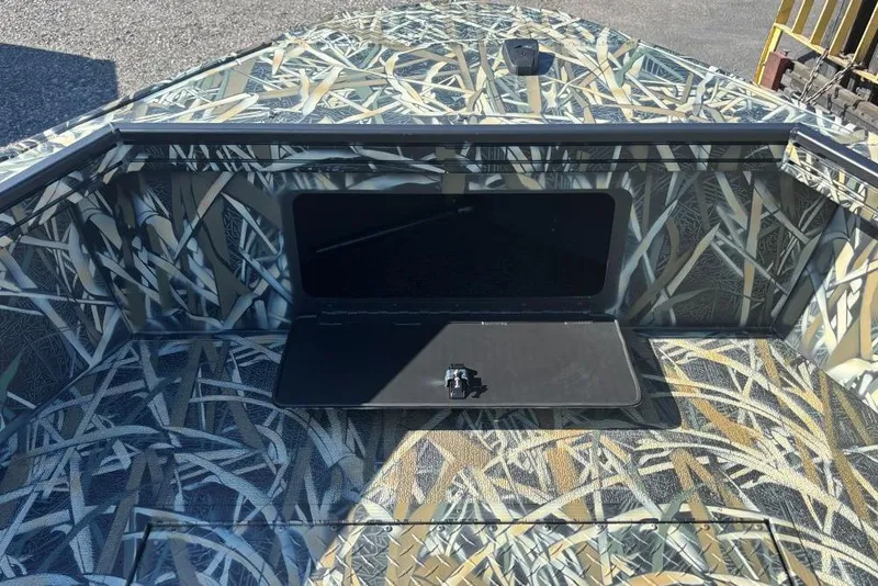 Slide: The Image of 2026 Smoker Craft Pro Sportsman 1872 T boat with camouflage design and open storage compartment. - 5