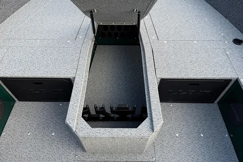 Slide: The Image of 2026 Lund 1700 Explorer Tiller boat interior with open storage compartments. - 12