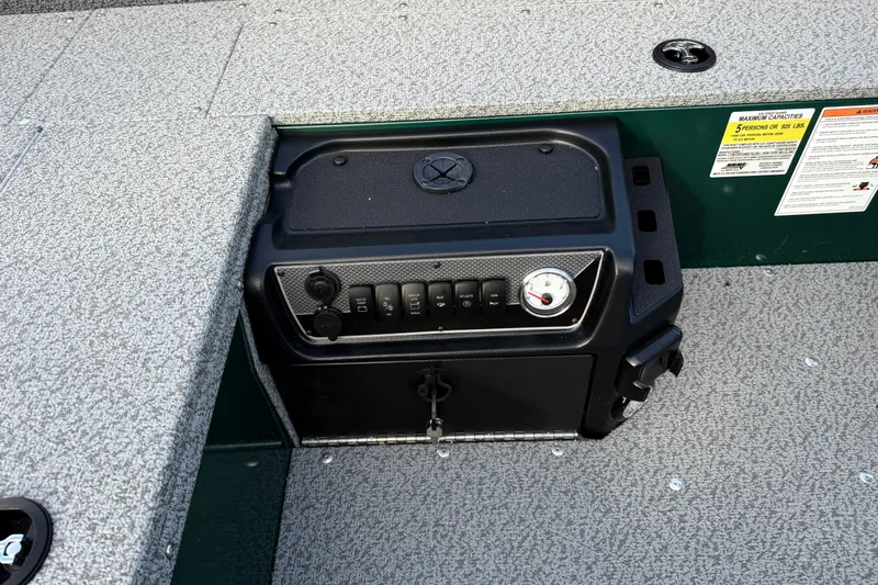 Slide: The Image of Control panel of 2026 Lund 1700 Explorer Tiller boat, featuring switches and gauge. - 17