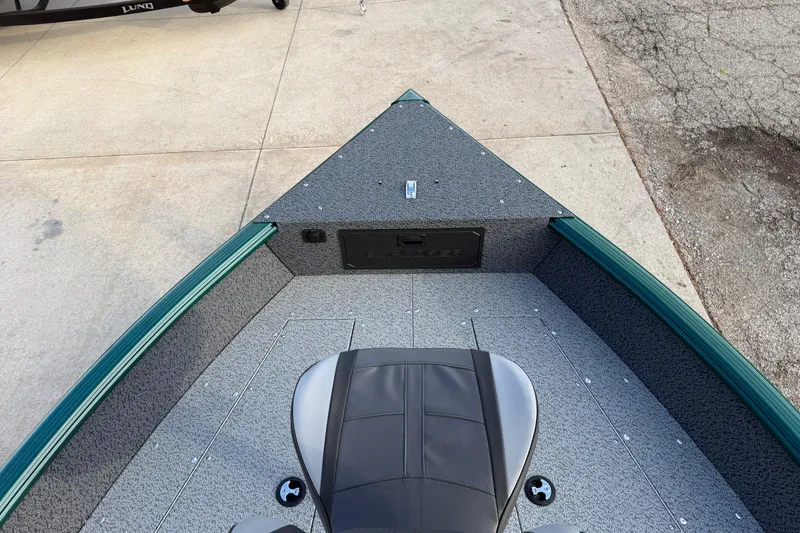 Slide: The Image of 2026 Lund 1700 Explorer Tiller boat interior with seating and storage compartments. - 8