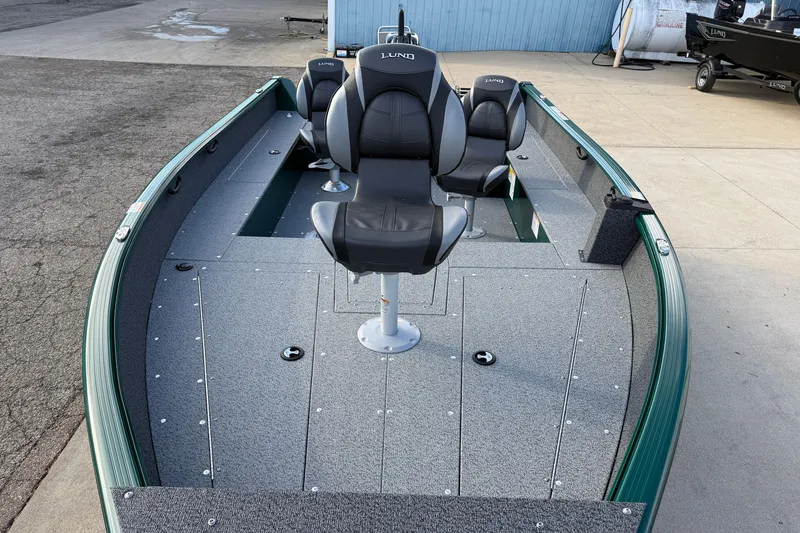 Slide: The Image of 2026 Lund 1700 Explorer Tiller boat with sleek seating and spacious deck design. - 9