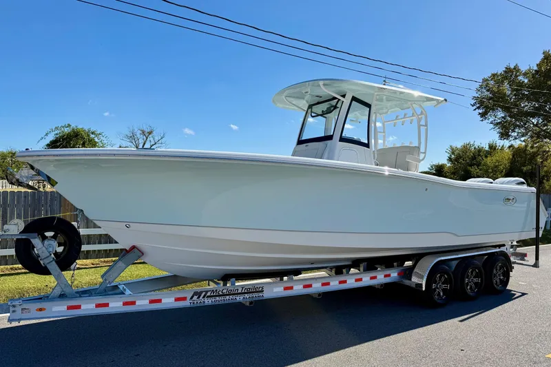 The Image of 2026 Sea Hunt Gamefish 30 Coffin Box boat on trailer, side view. - 1