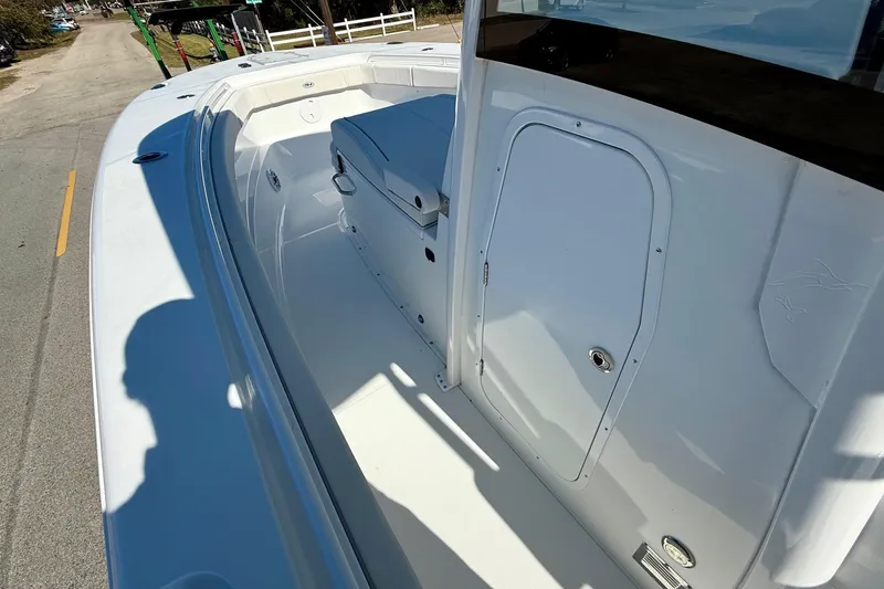 Slide: The Image of 2026 Sea Hunt Gamefish 30 Coffin Box boat interior, featuring spacious deck and storage. - 13