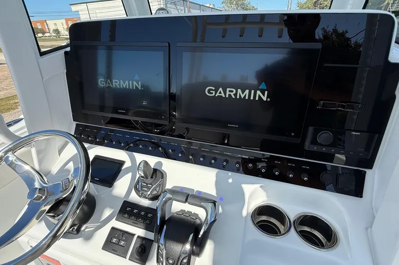 Slide: The Image of 2026 Sea Hunt Gamefish 30 Coffin Box dashboard with dual Garmin displays and controls. - 18