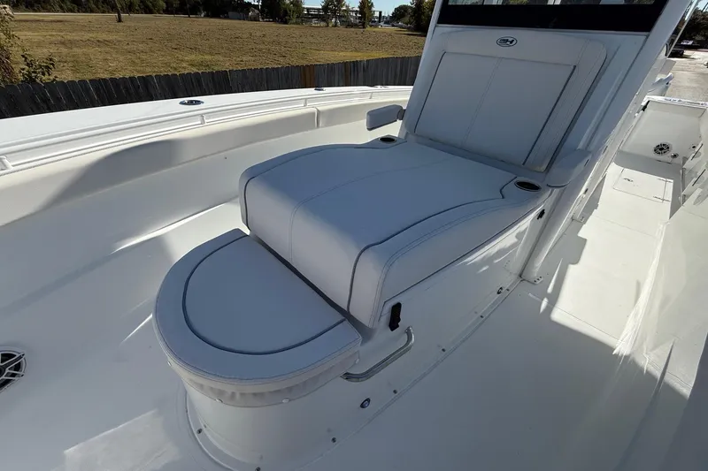 Slide: The Image of 2026 Sea Hunt Gamefish 30 Coffin Box boat interior with cushioned seating. - 23