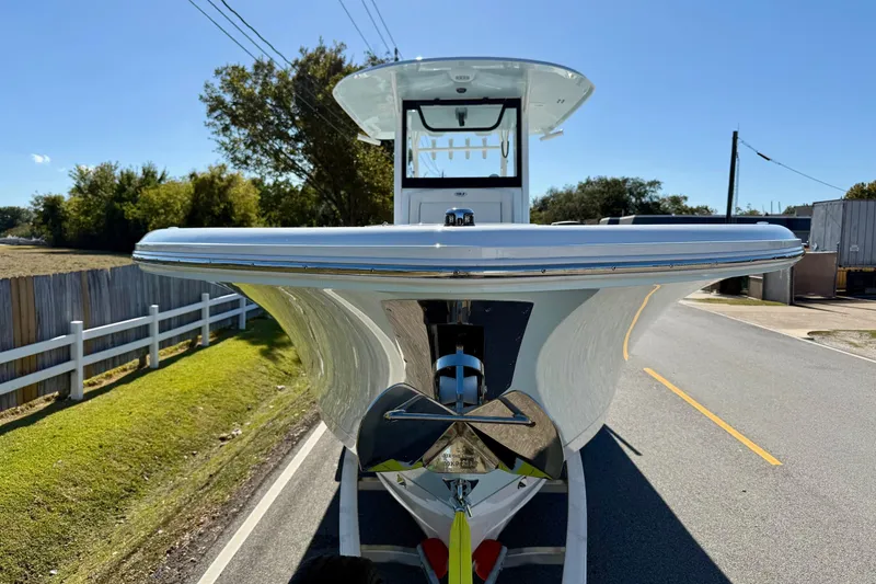 Slide: The Image of 2026 Sea Hunt Gamefish 30 Coffin Box boat on trailer, front view, sunny day. - 6