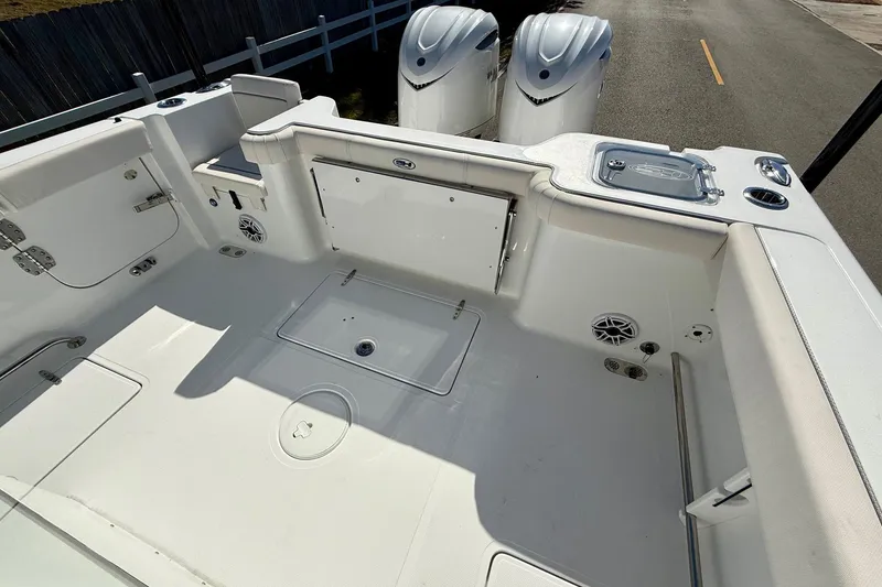 Slide: The Image of 2026 Sea Hunt Gamefish 30 Coffin Box boat interior with dual engines and spacious deck. - 8
