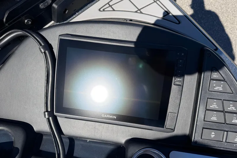 Slide: The Image of Garmin display on 2026 Caymas XS 21 Pro boat dashboard with control buttons. - 13