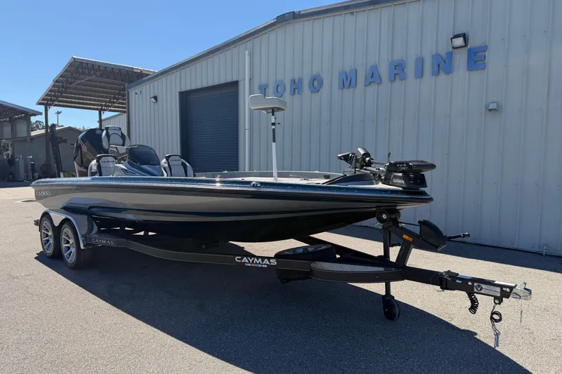 Slide: The Image of 2026 Caymas XS 21 Pro boat on trailer at Toho Marine dealership. - 7