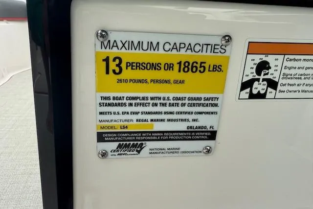 Slide: The Image of 2021 Regal LS4 Surf capacity label: 13 persons or 1865 lbs, compliant with safety standards. - 12