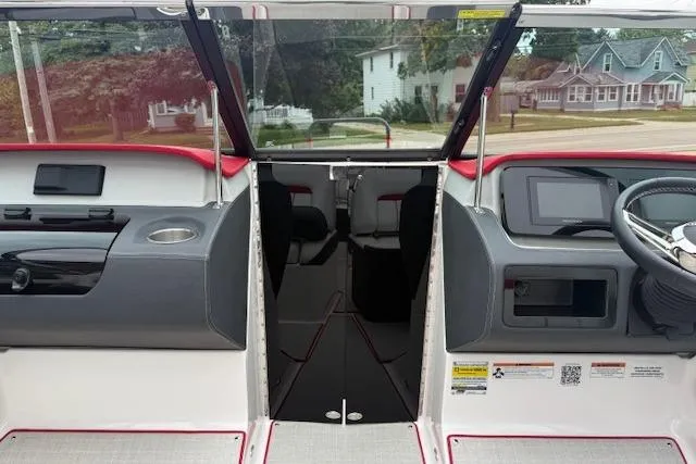 Slide: The Image of 2021 Regal LS4 Surf boat interior with dashboard and steering wheel. - 15