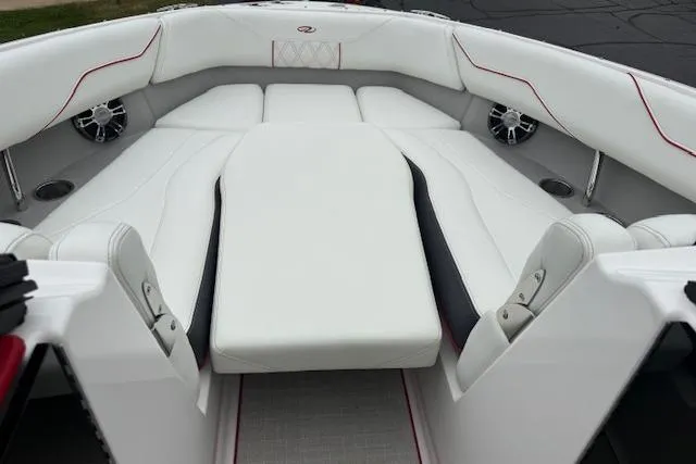 Slide: The Image of 2021 Regal LS4 Surf boat interior with white seating and red accents. - 18