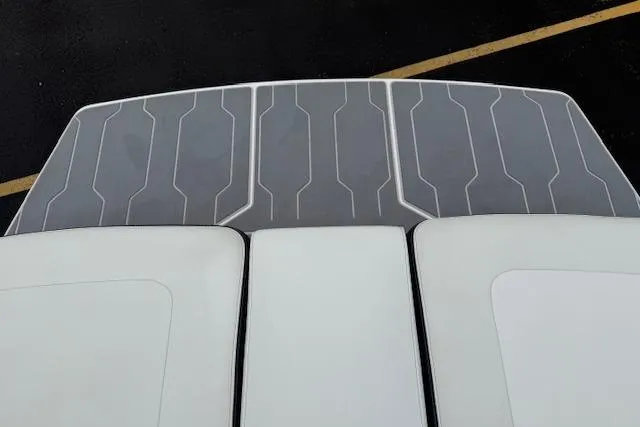 Slide: The Image of 2021 Regal LS4 Surf boat deck with sleek, modern design and textured surface. - 23
