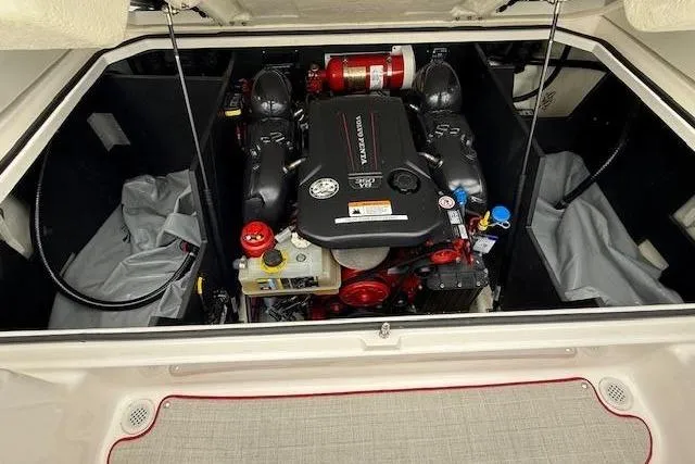 Slide: The Image of Engine compartment of a 2021 Regal LS4 Surf boat, featuring a powerful inboard motor. - 26