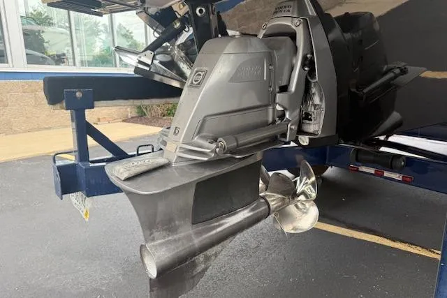 Slide: The Image of 2021 Regal LS4 Surf boat with Volvo Penta outdrive, showcasing propeller and stern details. - 30