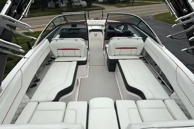 Slide: The Image of 2021 Regal LS4 Surf boat interior with luxurious white seating and modern design. - 7