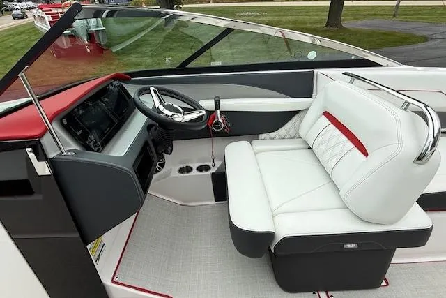 Slide: The Image of 2021 Regal LS4 Surf boat interior with white seating and modern dashboard. - 8