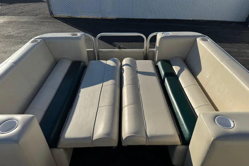 Slide: The Image of 2003 Odyssey Pontoons 2102 Millennium interior with cushioned seating and cup holders. - 10