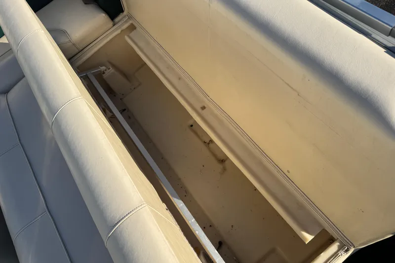 Slide: The Image of Open storage compartment in 2003 Odyssey Pontoons 2102 Millennium boat seat. - 18